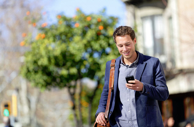 Mobile Commerce - Man using smartphone 